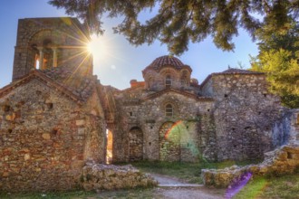 Abandoned stone church in sunlight, surrounded by trees and medieval atmosphere, UNESCO World