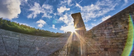 Rays of sun over ancient ruins, with a dramatic sky full of clouds, UNESCO World Heritage Site,