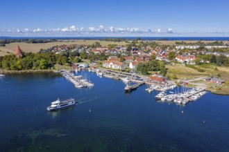 Aerial view over sailing boats in the harbour, marina of the village Kirchdorf in the Bay of