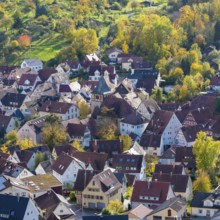 View of a picturesque village with red roofs and autumn trees, Strümpfelbach im Remstal,