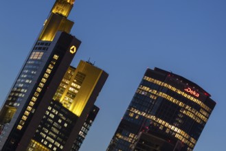 The towers of Commerzbank and Deka Bank in Frankfurt am Main light up in the evening, Frankfurt am