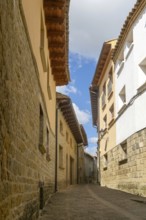 Narrow road alleyway street in medieval village of Uncastillo, Cinco Villas, Zaragoza province,