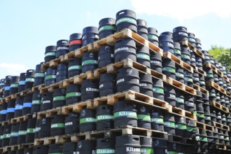 Black stacked beer kegs from the Kitzmann brewery, founded in Erlangen in 1712. Following the