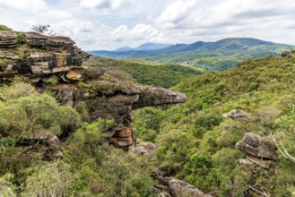 Mountains and forests of the state of Minas Gerais and a rock formation known as the Alligator Rock