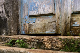 Details of an old baroque church door made of wood, weathered by time, in Ouro Preto city, Ouro