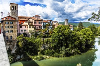 Ponte del Diavolo from the 15th century leads across the Natisone river to the old town, Devil's