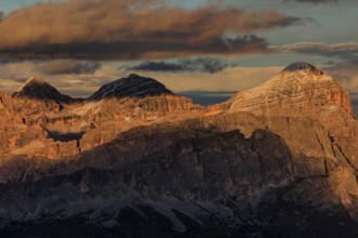 Steep mountains, mountain range, sunset, cloudy, autumn, Pordoi Pass, view of Tofana Group,