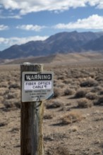 Round Mountain, Nevada - A sign warns of a buried fiber optic cable in the Nevada desert