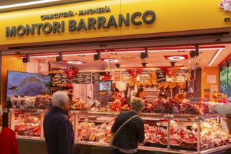 Market stall shop store selling butcher meat products inside Mercado Central de Zaragoza, Zaragoza,