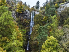 Autumn colours over Pistyll Rhaeadr Waterfall and Berwyn Mountains from a drone, Oswestry,