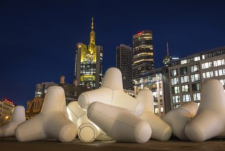Illuminated tetrapods lie at Hauptwache in front of Frankfurt's banking skyline, Frankfurt, Hesse,