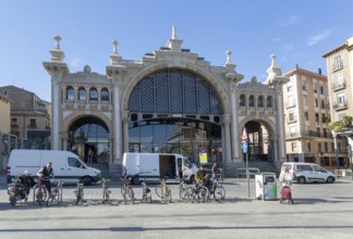 People vehicles street by central market building, Mercado Central de Zaragoza, Zaragoza, Aragon,
