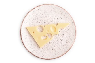 Piece of cheese with holes on plate isolated on white background, top view, flat lay, copy space,