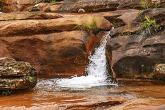 Waterfall with water flowing between the rocks in Minas Gerais, Brazil