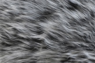Close up of gray and white synthetic fake fur