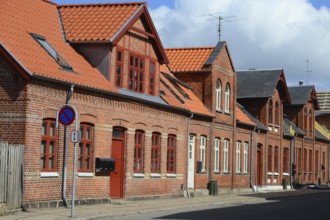 Row of brick houses along a street in Assens, Funen island, Denmark, Scandinavia