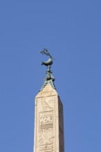 Peace dove bird sculture on the top of a building in the city of Rome, Italy