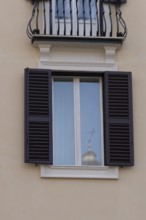 Window of a building in the city of Rome, Italy