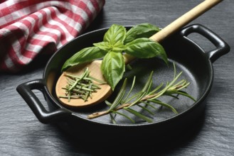 Rosemary, rosemary leaves and rosemary sprig with cooking pot