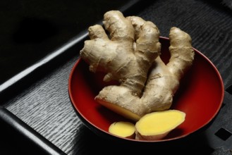Ginger, ginger root in tea bowl, Zingiber officinale, tea preparation