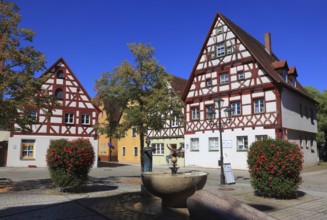 Half-timbered houses and fountains on Rathausplatz, city of Heideck in the district of Roth, Middle