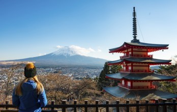 Tourist enjoying the view, five-story pagoda of a Shinto shrine, Chureito Pagoda, with views of
