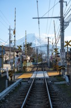 Rails of a railway line, behind Vulkan Mt. Fuji, Fujiyoshida, Yamanashi Prefecture, Japan