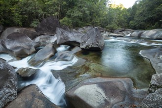 Turquoise blue water between rocks in the tropical rainforest of Babinda Boulders Queensland