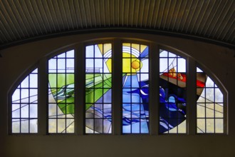 Lead glazing of the windows above the main entrance with the title Four Elements by Horst