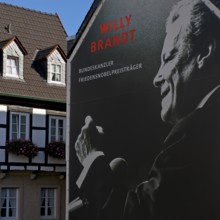 Huge poster with Willy Brandt portrait on a fire wall of the Willy Brandt Forum next to a