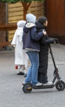 City center, shopping street, Kettwiger Straße pedestrian zone in Essen, 2 young woman on an
