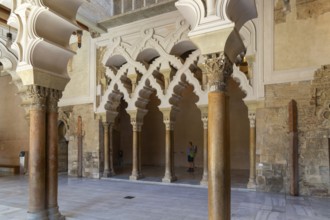 Ornate Islamic design of decorated Moorish arches, Aljafería Palace, Zaragoza, Aragon, Spain