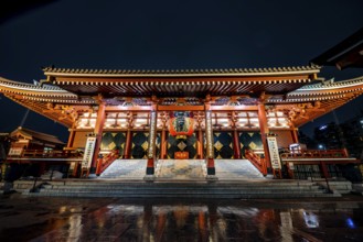 Illuminated main hall of Asakusa Shrine or Senso-ji Temple, at night, Buddhist temple complex,