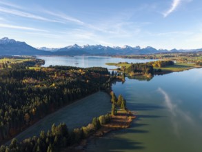 A quiet lake with forest and mountains, autumn colors are reflected in the water, Illasbergsee,