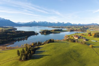 Idyllic scenery with vast meadows, a quiet lake and a mountain range, Illasbergsee, Forggensee,