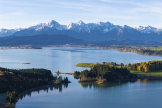 Nature panorama with a large lake and mountain scenery in autumn light, Illasbergsee, Forggensee,