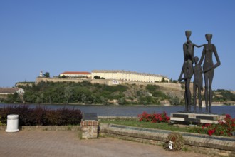 Memorial to the victims of the Novi Sad massacre, in the back the Petrovaradin Fortress or