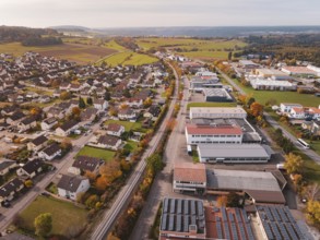 An urban landscape in autumn with a Hermann Hesse Bahn railway line surrounded by houses and