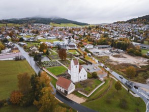 Small town with a central church, nestled in an autumn-colored area, Wehingen, Tuttlingen district,