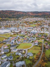 Residential area surrounded by vivid autumn colors on the surrounding hills, Wehingen, Tuttlingen