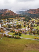 Small village in a hilly autumn landscape surrounded by fog, Wehingen, Tuttlingen district, Germany