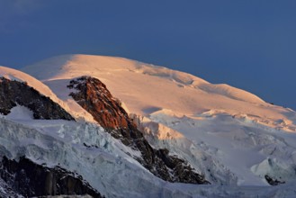Snow-covered Mont-Blanc in the light of the setting sun, Chamonix-Mont-Blanc, Haute-Savoie, France