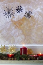 Christmassy decorated iced window, candle light, straw stars, Germany