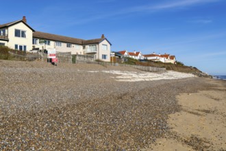 For Sale estate agent signs outside houses at risk of coastal erosion, Thorpeness, Suffolk, North