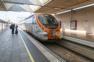 Renfe Civia commuter train at platform of Airport railway station, Rodalia de Barcelona suburban