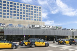 Taxis in street outside Barcelona-Sants railway station building in city centre, Barcelona,