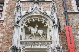 Gruuthusemuseum with equestrian statue of Lodewijk van Gruuthuse above the entrance portal in the