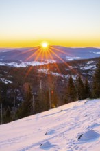 Sunrise over the hills of czech republic from Mount Lusen wth the view over the hills of the