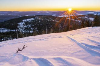 Sunrise over the hills of czech republic from Mount Lusen wth the view over the hills of the