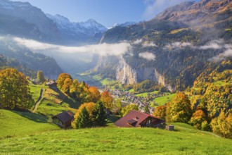 View from the village of the Lauterbrunnen Valley with Staubbach waterfall in autumn with morning